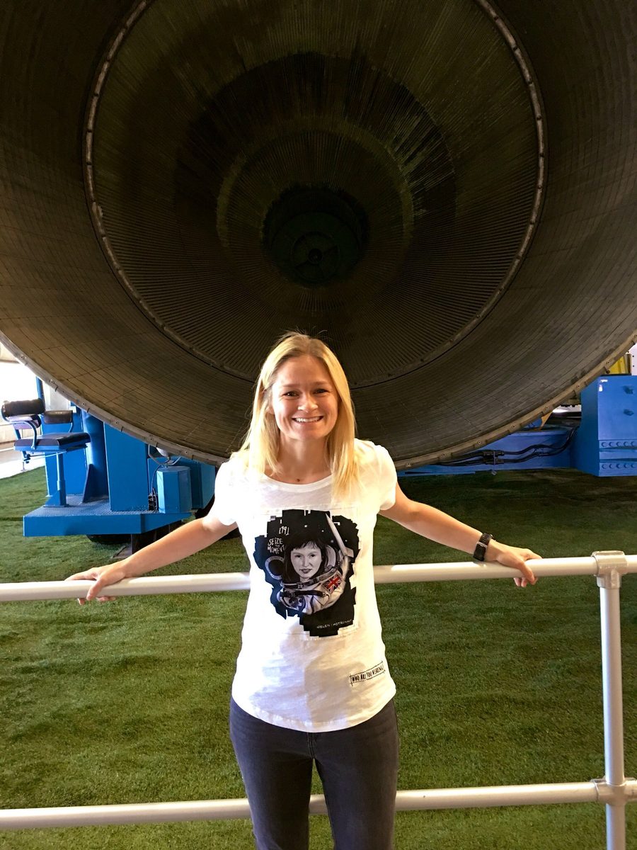 Tess in front of the Saturn V rocket at NASA Johnson Space Center