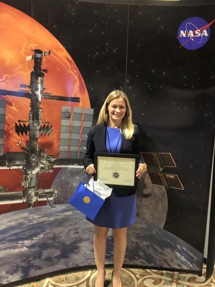 Tess Morris-Paterson receiving a NASA research award