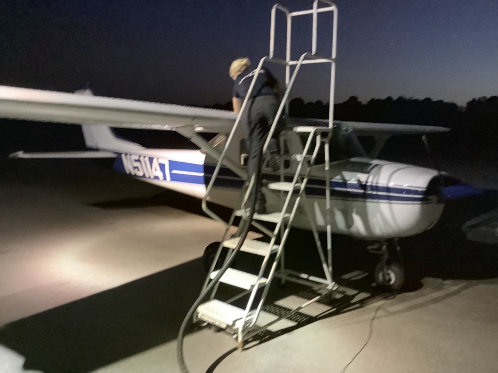 N51147, the second borrowed Cessna 150, being checked over at night