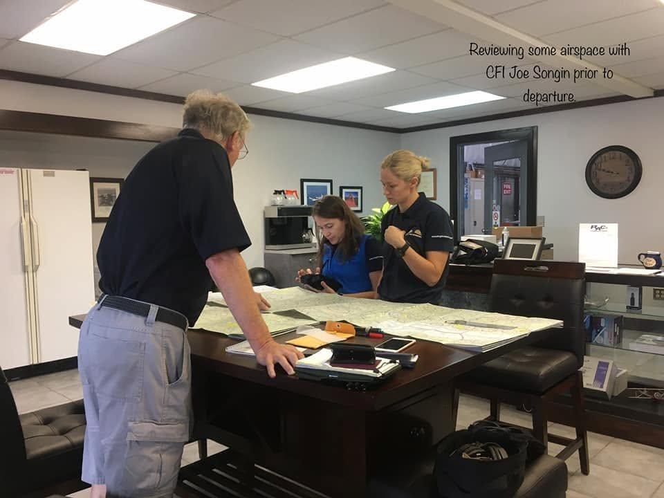 Reviewing airspace over charts with CFI Joe Songin before departure